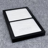 Rechteckiger Ersatzfilter mit weißem Filtervlies in schwarzem PLA+‑Rahmen, passend für Buderus Logavent HRV21 - kompatible Ersatzfilter bei PMH FILTER SERVICE.